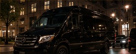 Black Mercedes-Benz Sprinter in a professional touring environment